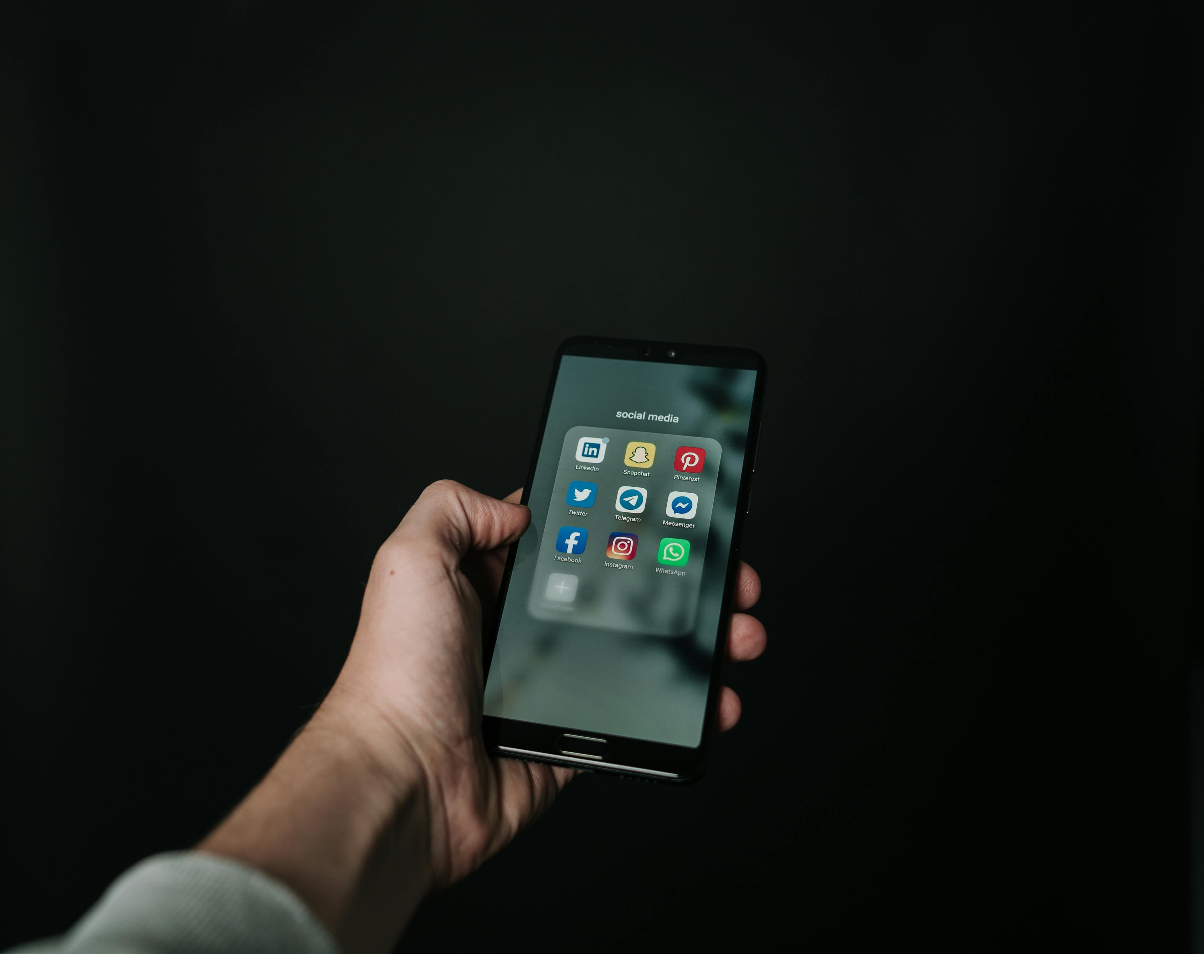 A phone with various app icons